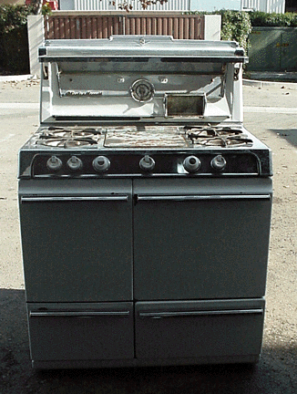 Late 1950's 36" O'Keefe & Merritt Stove with folding glass shelf clock timer 